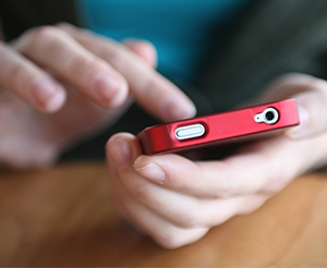 Parent holding a mobile phone