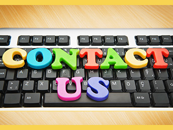 Contact Us spelled out on a keyboard with colorful letters