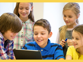Students crowded around a tablet