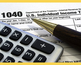 1040 tax form with pen and calculator