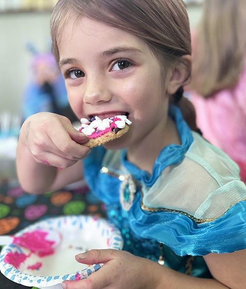 Girl eating a cookie