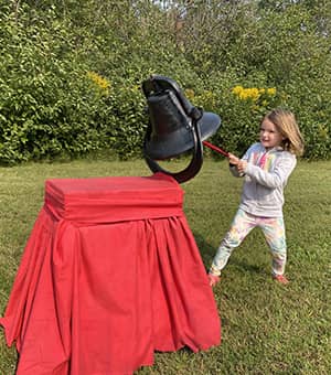 Student ringing a bell