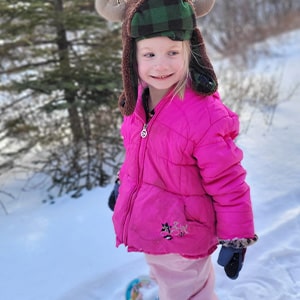 Student playing in the snow
