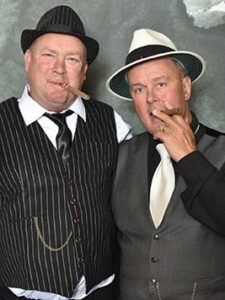 Two men smoking cigars