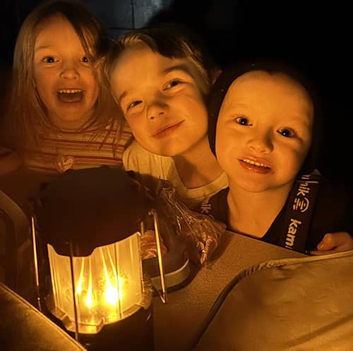 Three students enjoying lantern lunch