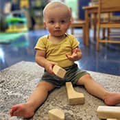 Child playing with wooden blocks