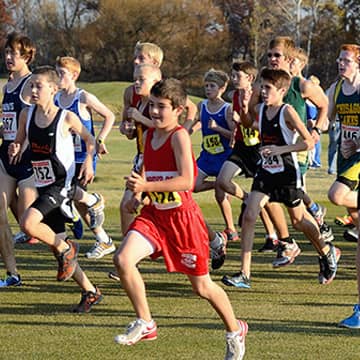 Large group of athletes running in a race