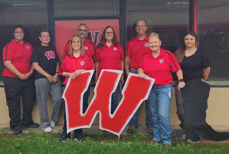 Happy students in cafeteria Happy students sitting at a blue table in the cafeteria