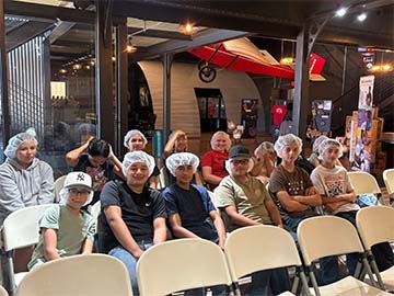 Students and staff wearing hair nets