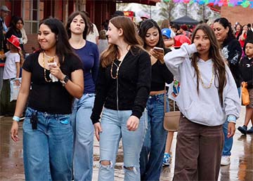 Students walking around a festival