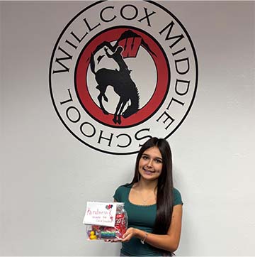 Student holding an award
