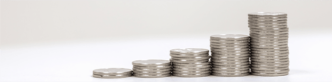 Five stacks of coins lined up next to each other