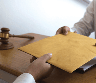 Court member handing over a big envelope