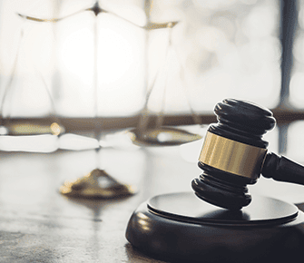 Wooden gavel on a courtroom table