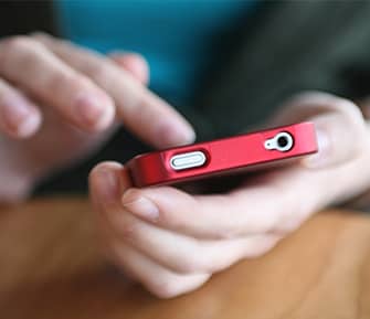 Adult using phone to search for election results