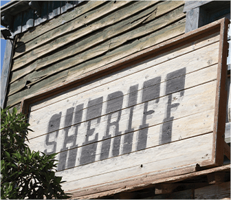 Sheriff sign made of wood on a building
