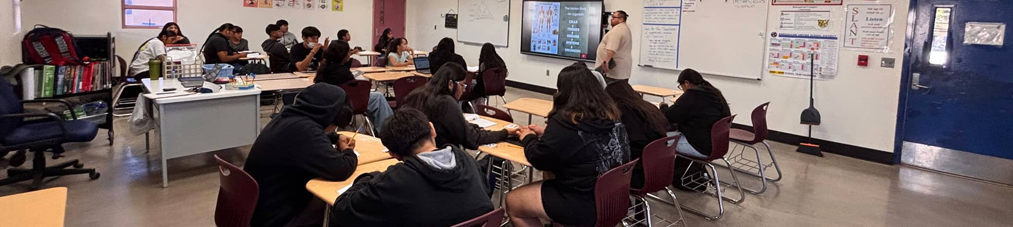 Students watching a class presentation