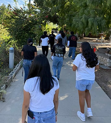 Students waking down a sidewalk