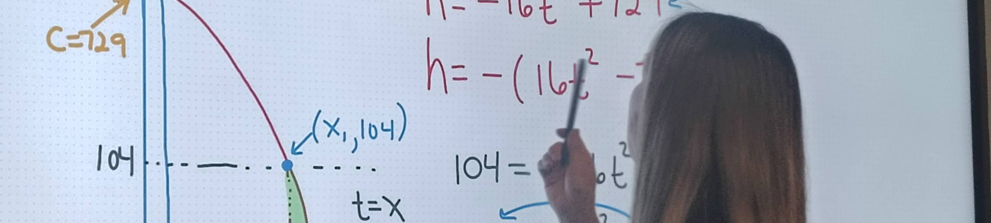 An adult working through a mathematical equation