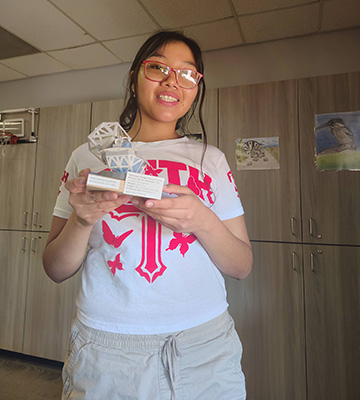 A student holing their science project