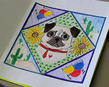 A paper quilt square with a dog and flowers
