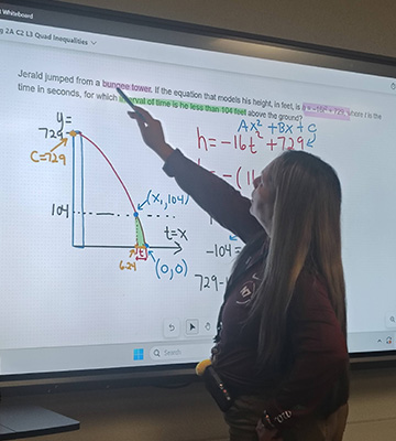 A teacher instructing on how to solve a mathematic equation