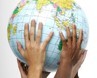 Hands on a globe