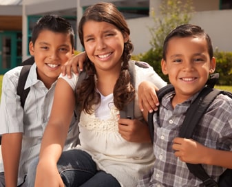 Three smiling students