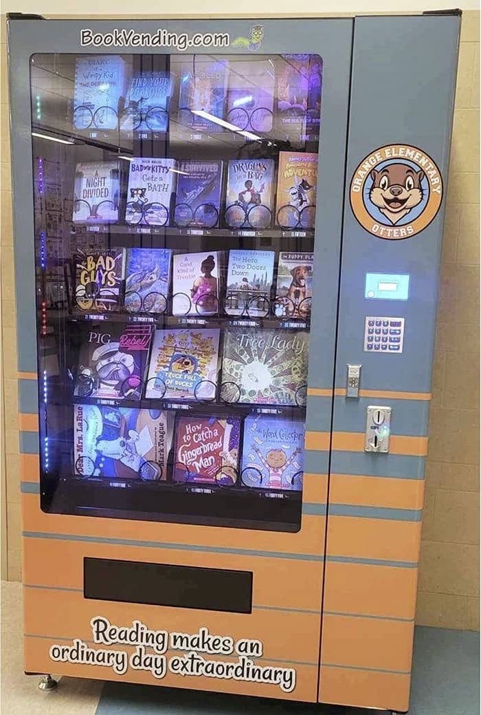 Book vending machine from BookVending.com with words Reading makes an ordinary day extraordinary.