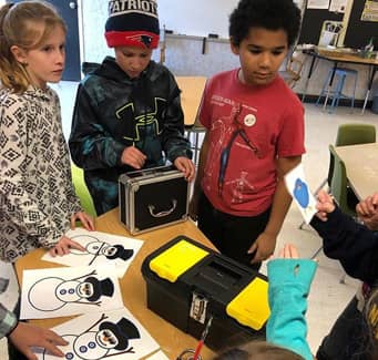 sidebargraphic_OurSchools students doing a class activity