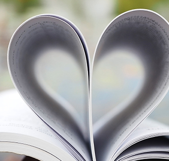 Book opened with pages forming a heart
