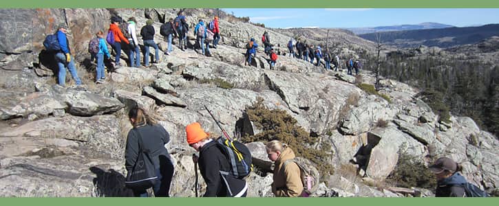 Group of students hiking in the mountains