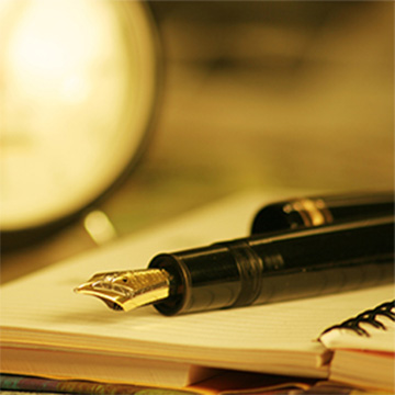 Fountain pen on an open notebook