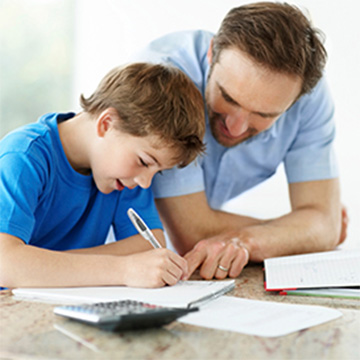 Dad helping his son with homework