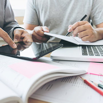 people working on a tablet
