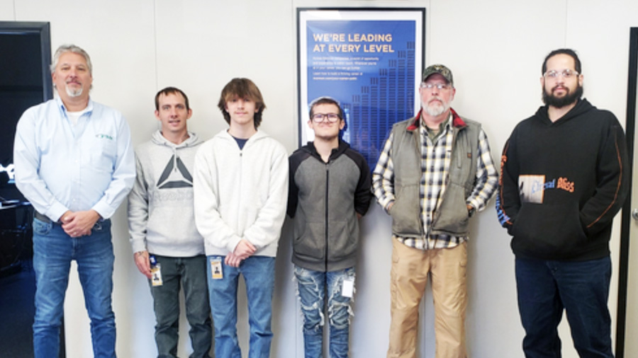 Group of adult manufacturing students posing for a picture