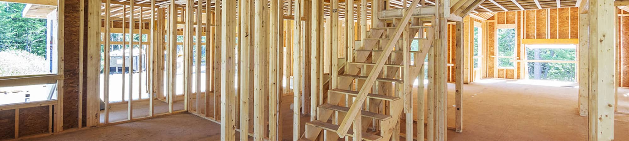 Construction students next to new construction site