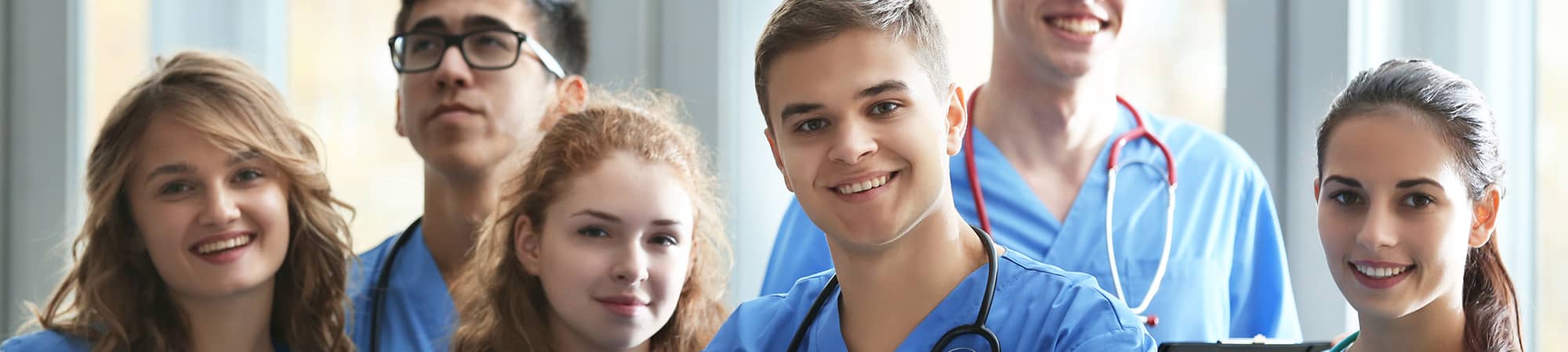 Three health assistants talking to each other