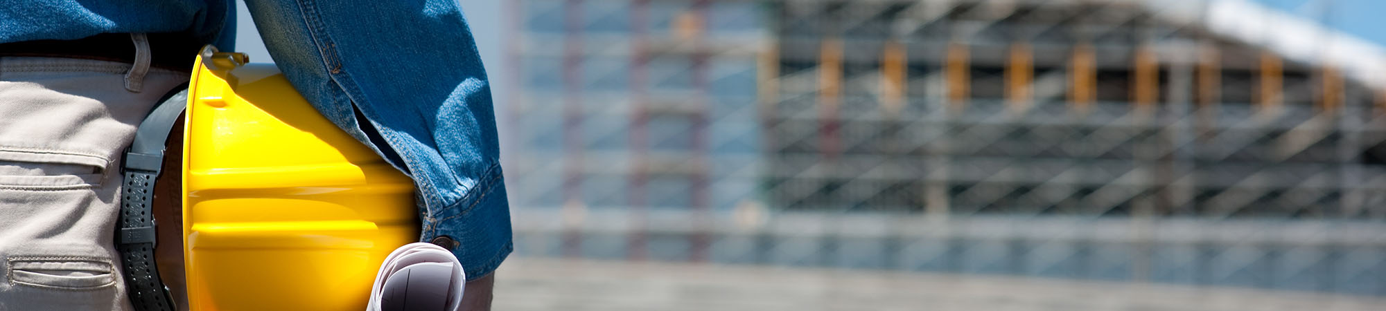 Construction working holding hat and plans