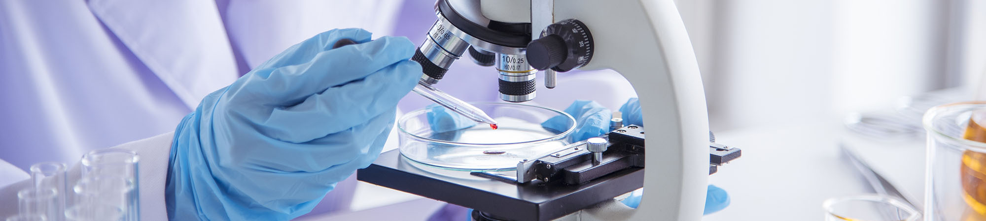 Close up view of a student using a microscope
