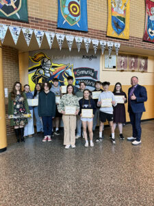 Principal with happy group of students representing student of the month for March 2026