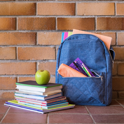 backpack and stack of books