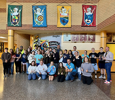 students smiling with certificates