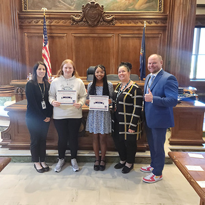 students being honored at a meeting