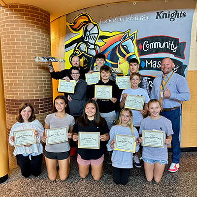 students holding awards