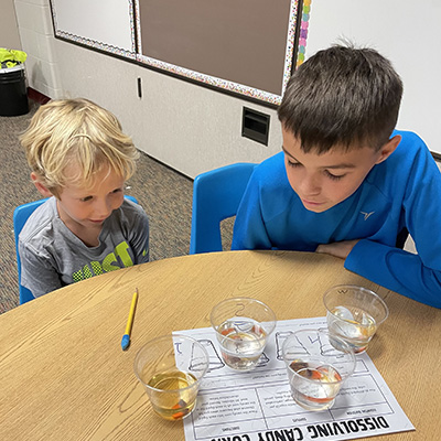 two students conducting a science experiment