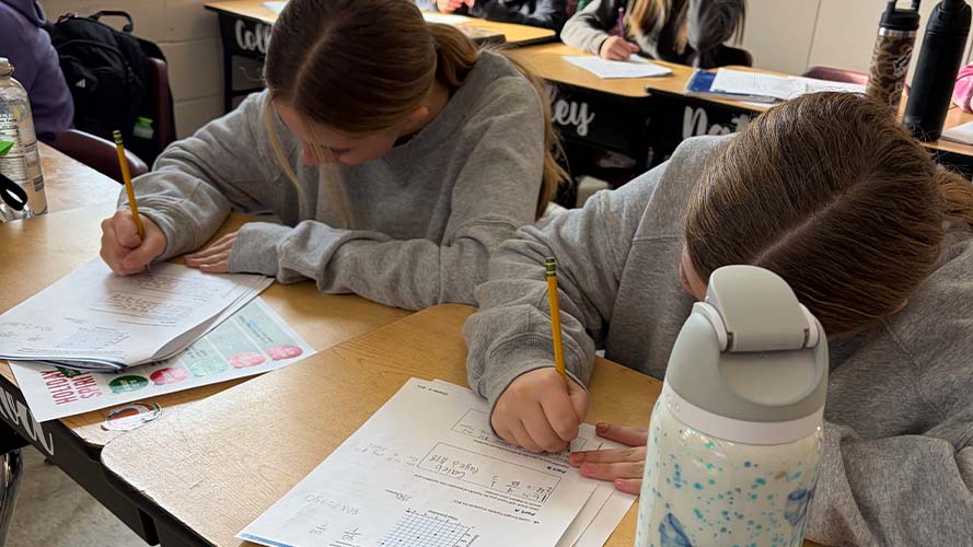 Two students working on math