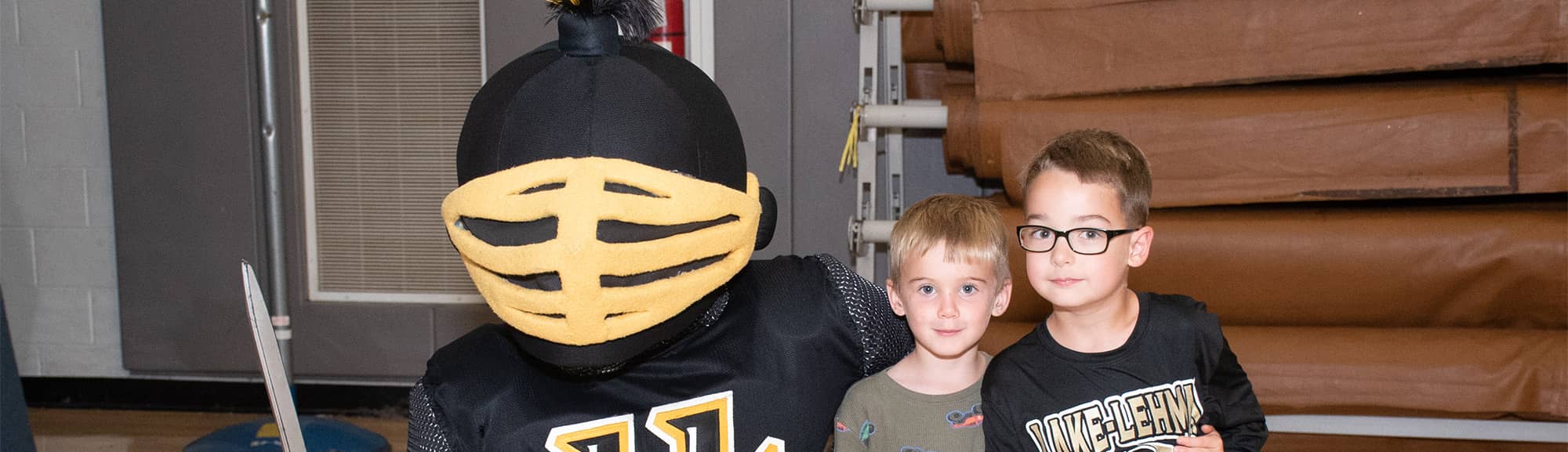 Two students with knight mascot