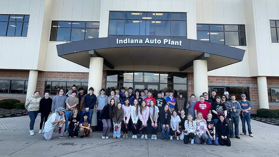 Sophomore students from both North and South Decatur posing for a picture in front of the Indiana Auto Plant