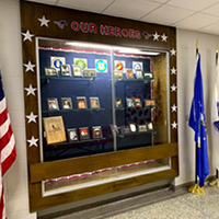 A display case with different flags on each side